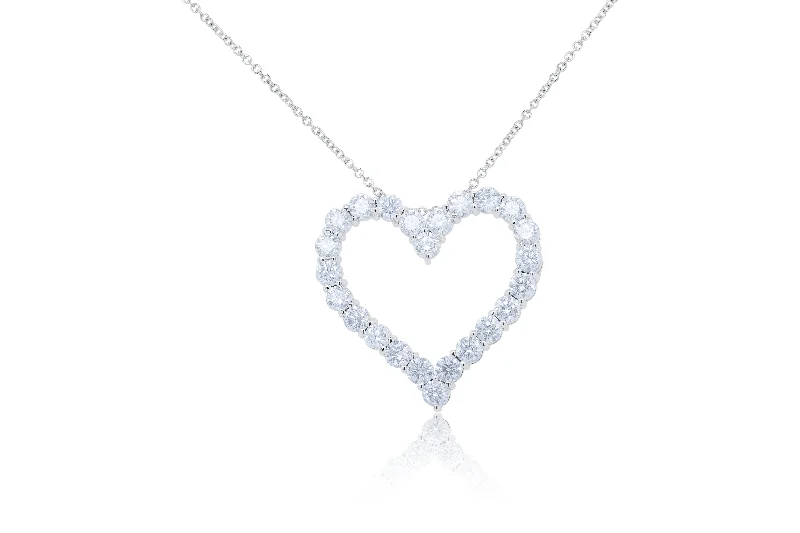 Premium Diamond Jewelry At Once-In-A-Lifetime Discounts Statement Fashion Offers 18kt white gold open heart pendant featuring 6.05 cts of round diamonds, 24 stones Premium Diamond Jewelry At Once-In-A-Lifetime Discounts Statement Fashion Offers 18kt white gold open heart pendant featuring 6.05 cts of round diamonds, 24 stones