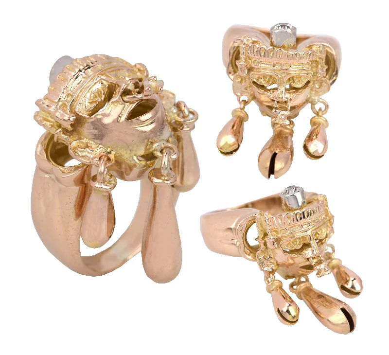 Shop Jewelry That Shines Without The High Price Sleek Style Discounts Modernist 14K Rose Gold Mayan 3D Tribal Mask Dangling Bell 0.15ct Diamond Ring Shop Jewelry That Shines Without The High Price Sleek Style Discounts Modernist 14K Rose Gold Mayan 3D Tribal Mask Dangling Bell 0.15ct Diamond Ring